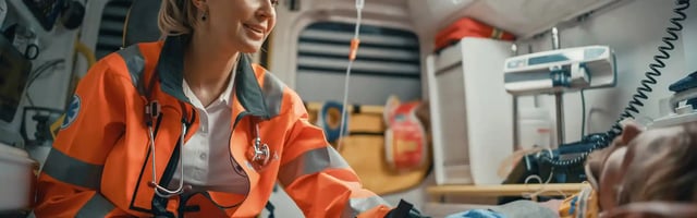 female-ems-professional-paramedic-comforting-injured-patient-on-the-way