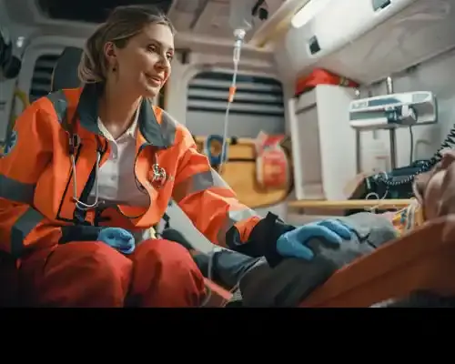 female-ems-professional-paramedic-comforting-injured-patient-on-the-way